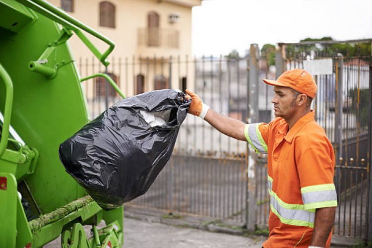 Cropped shot of a busy garbage collection worker