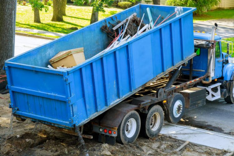 Loading the garbage container construction material and used in the container new building frame of a new house under construction