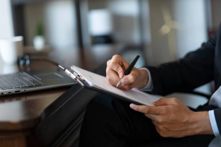unknown businessman prepares official document