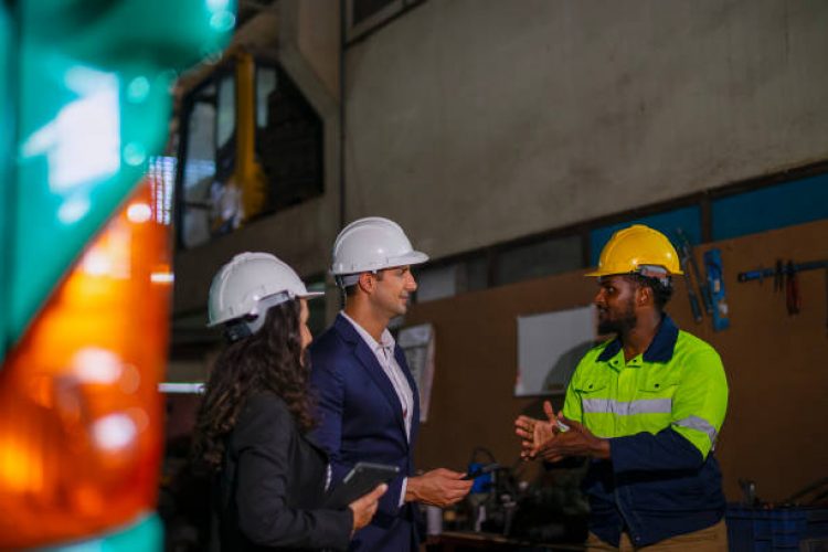 Engineer is meeting with business man at construction site. Industry and engineering concept.