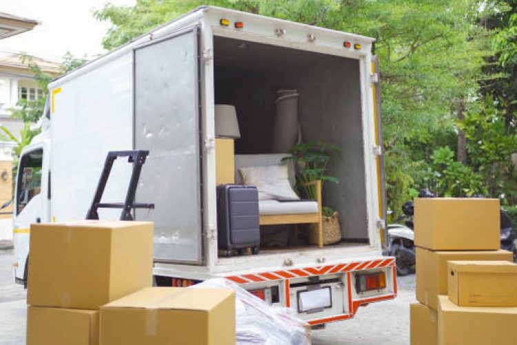 Truck car moving house for customers, delivering boxes and furniture. Vehicle transportation. Shipping and packaging business occupation service company. People lifestyle.