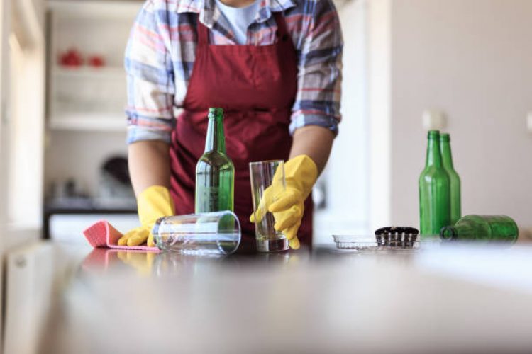 Young Woman Cleaning Kitchen