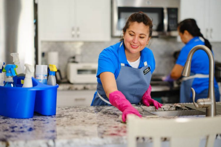 Professional housecleaning service at work in a home.