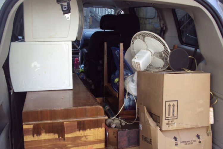 A mini van is loaded with household goods on moving day.